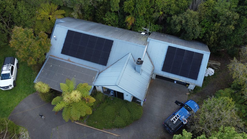 Clean Climate registered electricians installing a rooftop solar panel system on a home in Whakamarama, Bay of Plenty